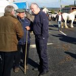 Michael Fitzmaurice TD talking to Miley Cash of Birr and other traders on his visit to the 2017 Banagher Horse Fair